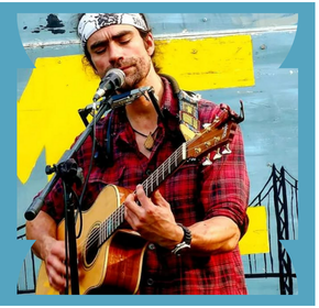 Man playing a guitar and singing into a microphone