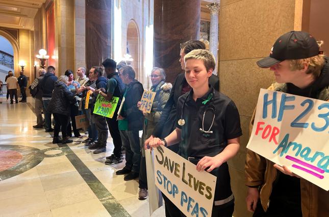 Rally outside MN legislature signs "Save lives stop PFAS" "for Amara"