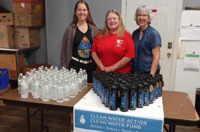 Collection of sturdy reusable water bottles next to disposable ones being replaced.
