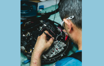 A man repairing electronics