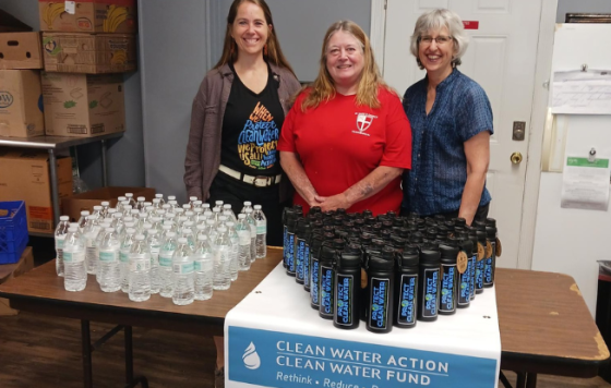 Collection of sturdy reusable water bottles next to disposable ones being replaced.