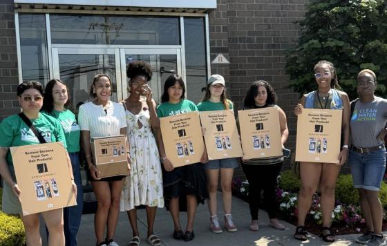 X Braithwaite and Tolani Taylor of Clean Water Action delivering petitions