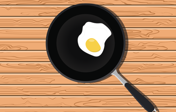 nonstick pan with an egg in it