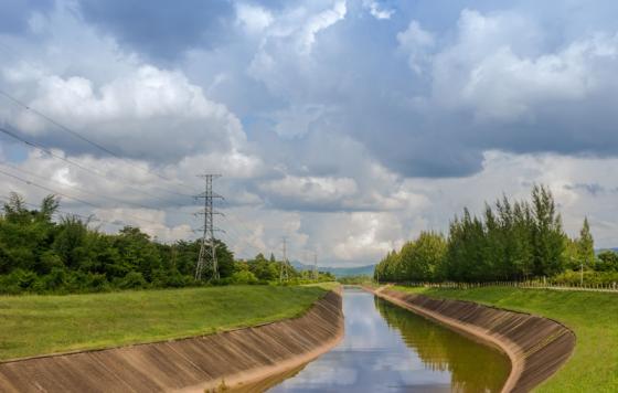 Manmade canal on a sunny day. Photo credit: nayneung1 / Shutterstock